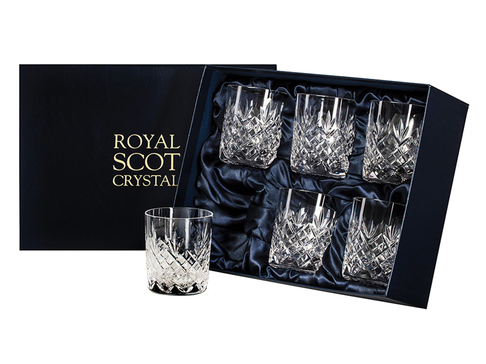 a set of six matching tumblers in a navy blue presentation box. The glasses are all engraved with a bed of diamonds around the base and a triple-flicked fan sitting above it, reaching towards the smooth rim