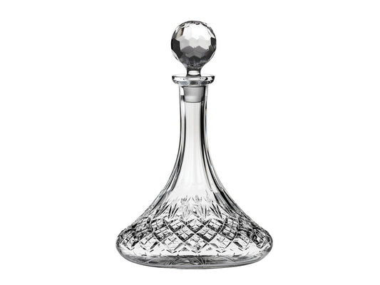A wide-bottomed decanter with a diamond pattern around the base, which moves into a series of three-pointed fans that go into the smooth, slender neck. It has a golf-ball style topper.