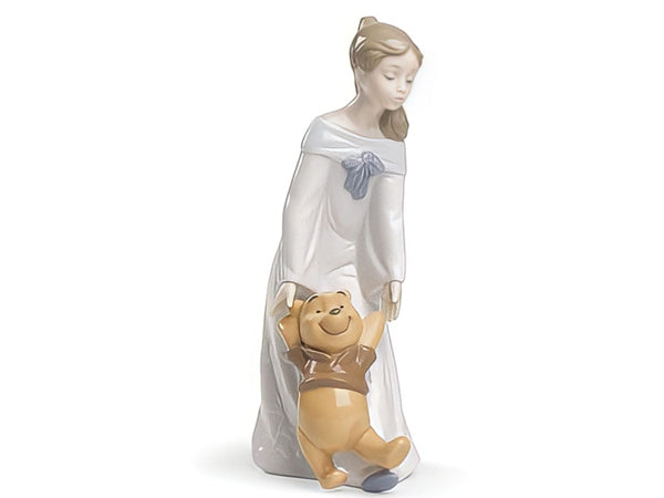 Nao Fun With Pooh made of porcelain and softly coloured in pastel hues. Depicting a young girl playing with Disneys favourite bear friend Winnie the Pooh. The perfect gift for any lover of Winnie the Pooh.