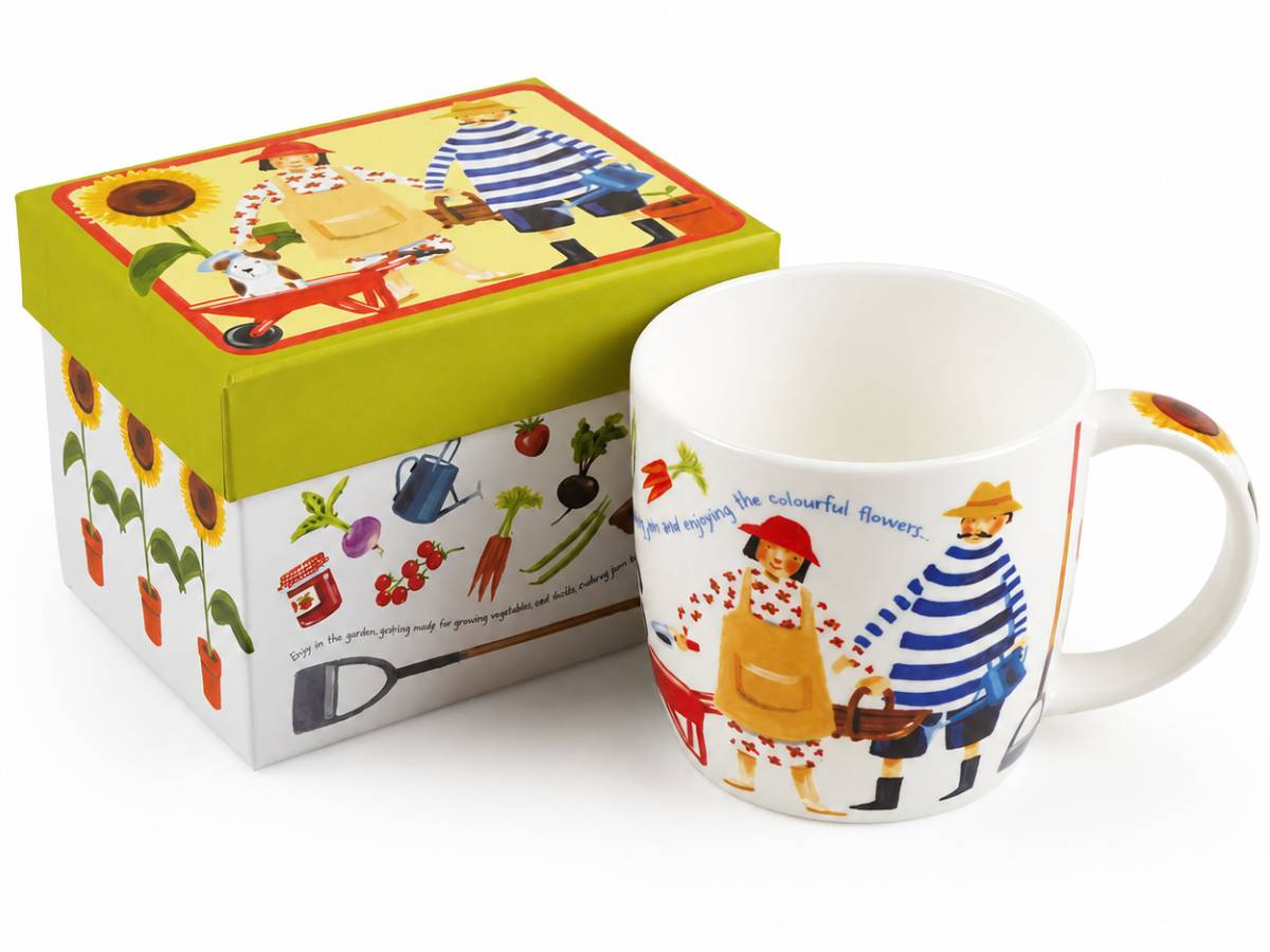 A white ceramic mug with a colorful gardening-themed illustration next to its matching green and white gift box, set against a plain white background.