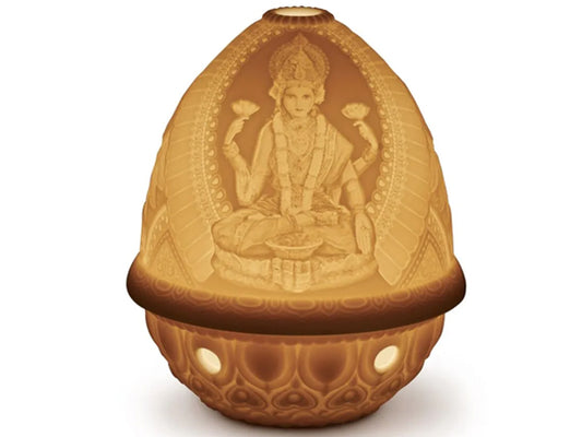 This amazing porcelain Lithophane Votive Light - Goddess Lakshmi who depicts good fortune and prosperity is delicately engraved and looks stunning when lit.