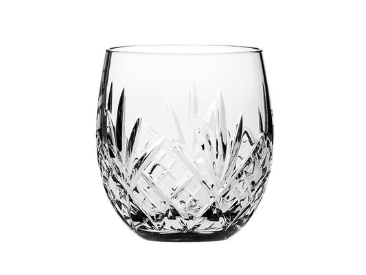 A crystal glass with a rounded bottom and engraved with a classic five-pointed fan