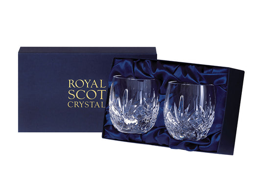 A pair of matching crystal barrel tumblers with a five-pointed fan design on a bed of diamonds cut around the base, arriving in a navy-blue silk-lined presentation box.