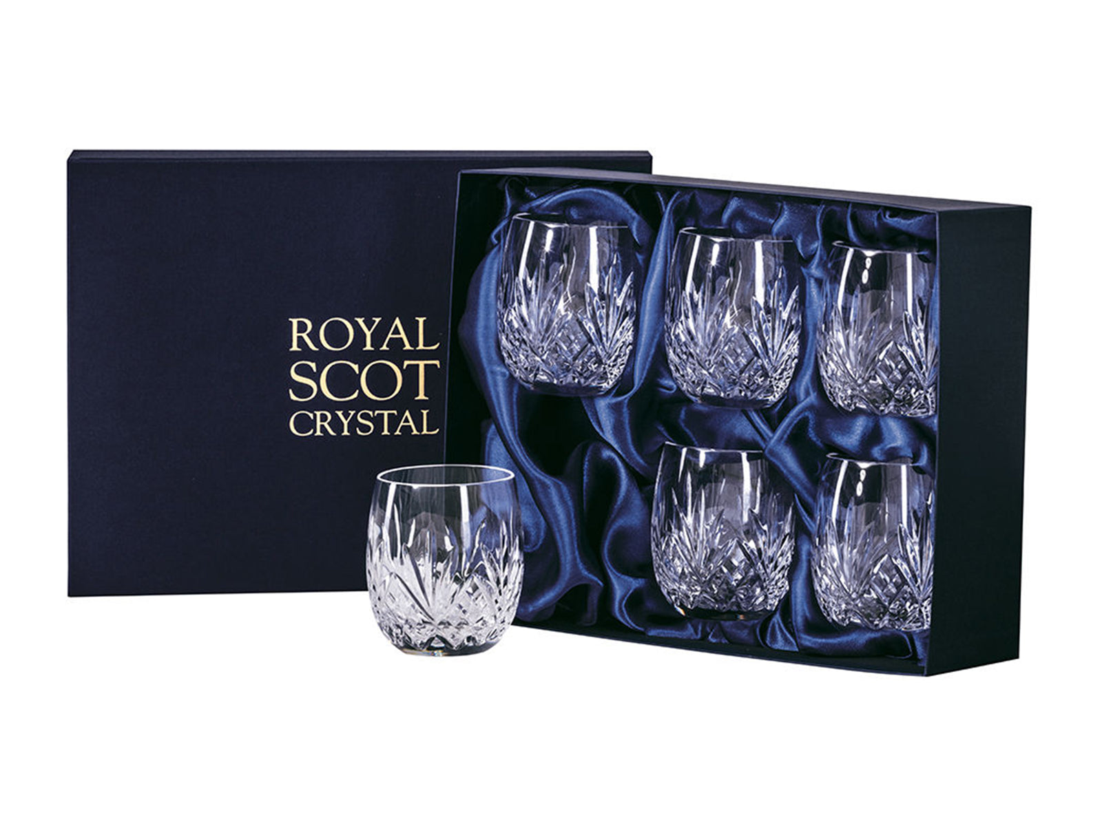 A set of six rounded gin and tonic tumblers with a bed of diamonds cut around the base, topped with deep five-pointed fans under a smooth rim. They come in a navy-blue silk-lined presentation box with gold branding on the lid.