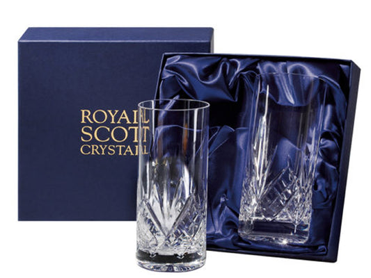 A pair of highball tumblers with a highland cut, which has a bed of diamonds around the base and a five-pointed fan reaching up towards the smooth rim