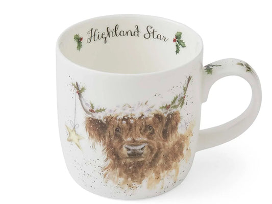 Mug with a highland cow design and 'Highland Star' text on a white background