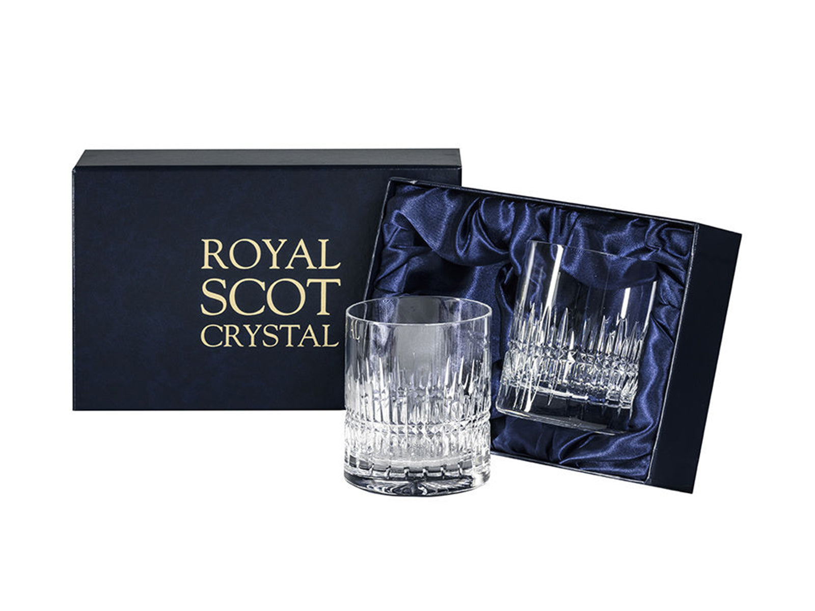 A pair of cut crystal whisky tumblers with vertical dashes around the base in a contemporary design. They come in a navy-blue silk-lined presentation box with gold branding on the lid
