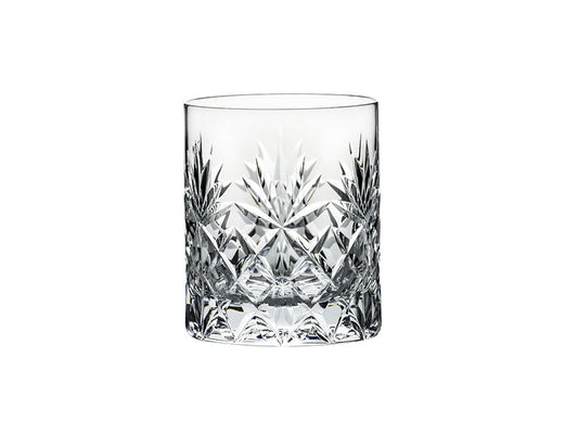 A large crystal tumbler with an intricate cut pattern that includes a seven-pointed fan