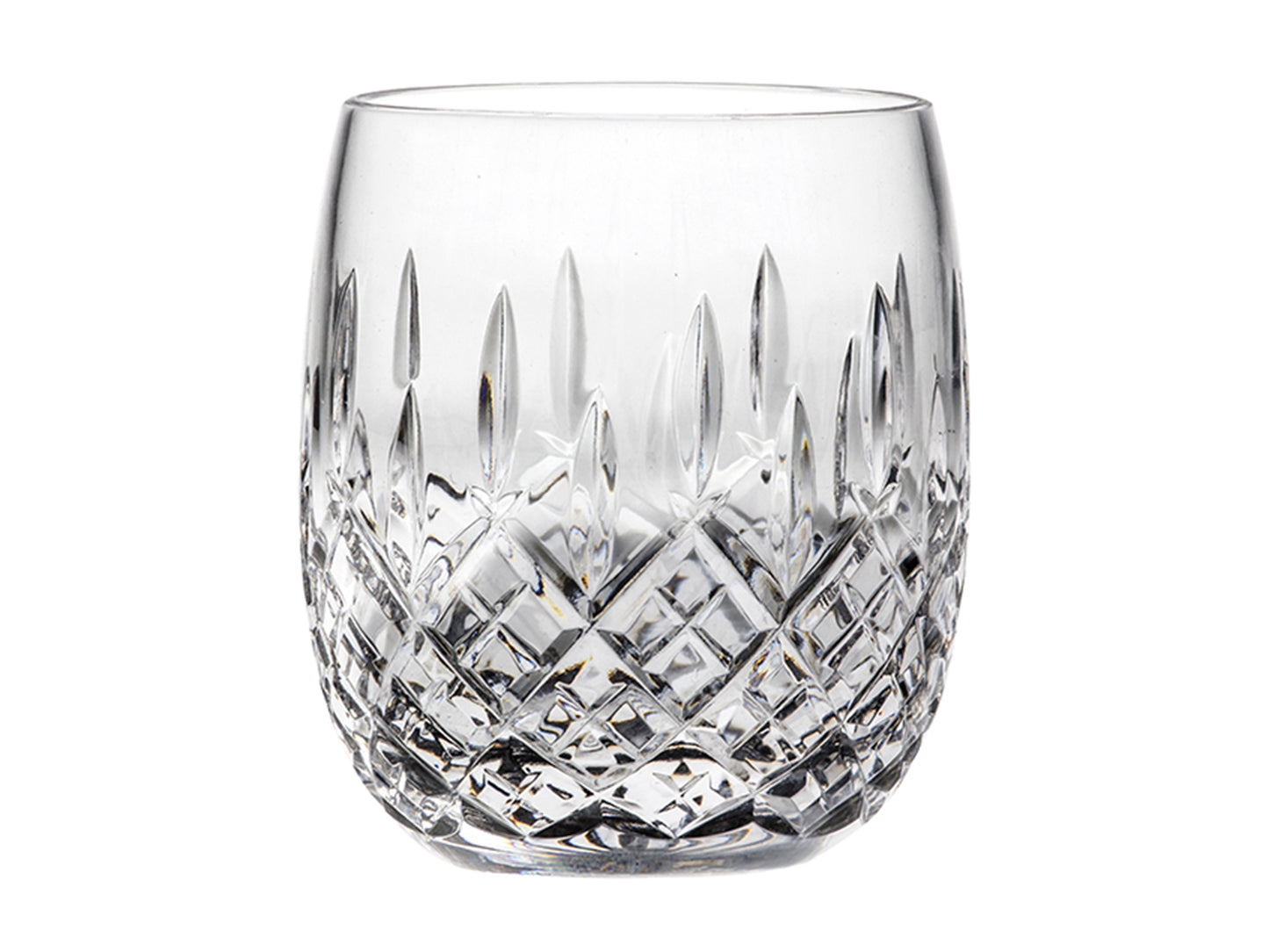 A rounded crystal tumbler with a diamond design cut into the base of the glass, with single darts pointing up towards the rim above it.