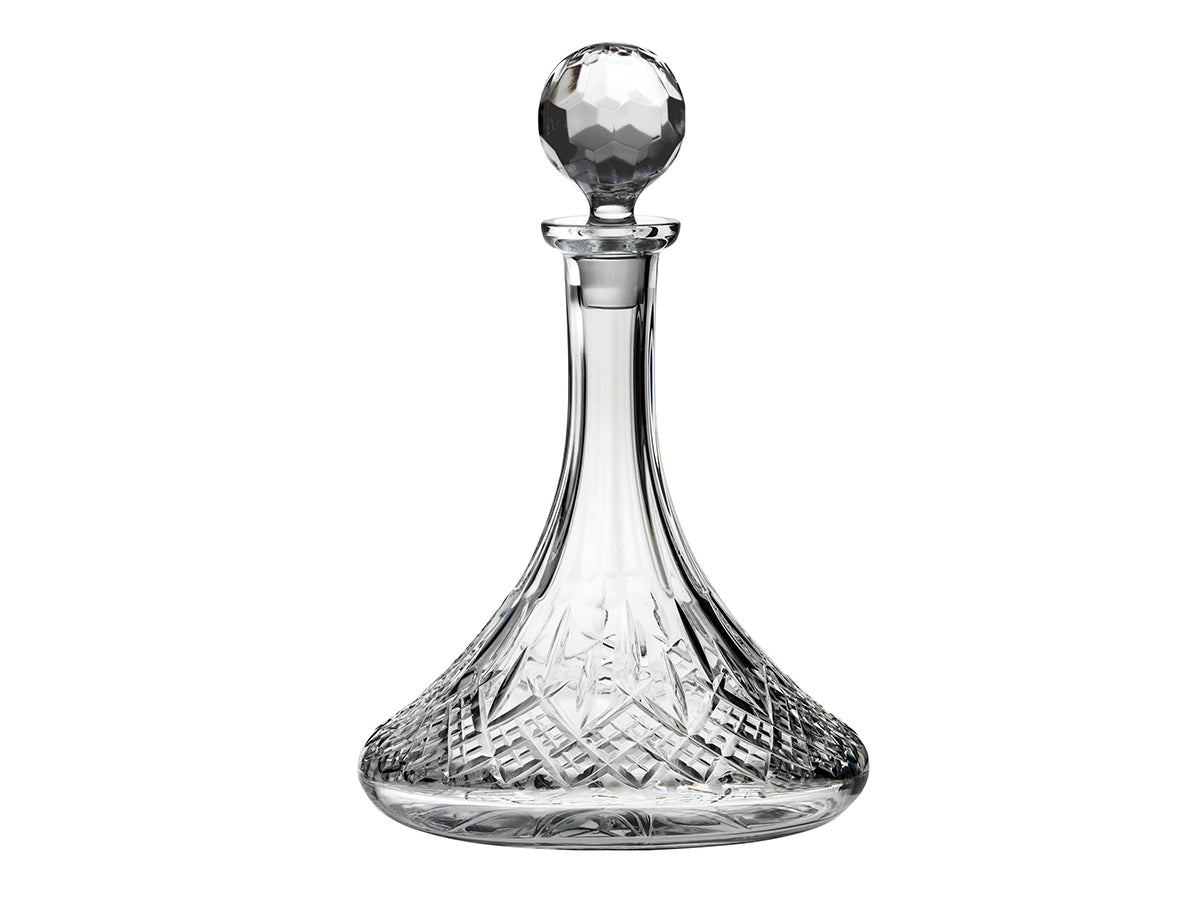 A classic ships decanter with a bed of diamonds cut around the base, with single dashes reaching up towards the slender neck. It comes with a golf-ball style topper which beautifully refracts light.
