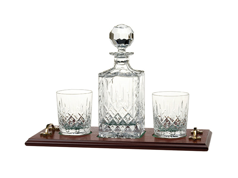 A crystal decanter and matching tumblers with an oak tray