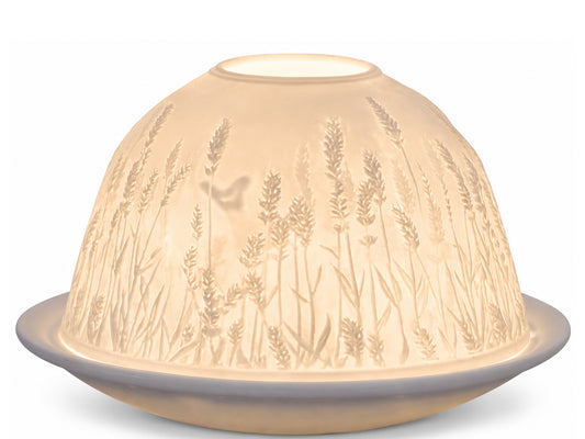 Light-Glow white unglazed porcelain dome tealight holder featuring an embossed lithophane design of a lavender field and a small butterfly, glowing warmly from within.