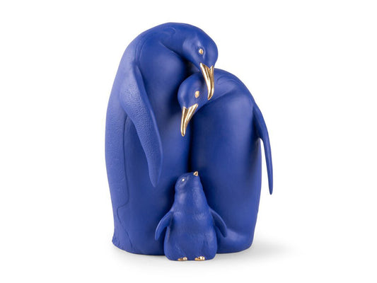 Family of Lladro Penguins huddled together. Created in blue and gold