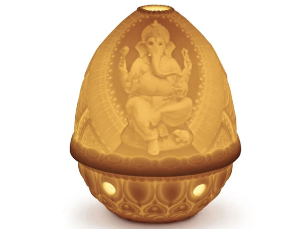 This amazing porcelain Lithophane Votive Light is delicately engraved with a seated Lord Genesha, which is wonderfully depicted when lit. This piece is just one of the beautiful lithophanes we offer in our lithophane collection.