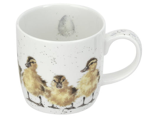 A white fine bone china mug with three brown and yellow ducklings on it