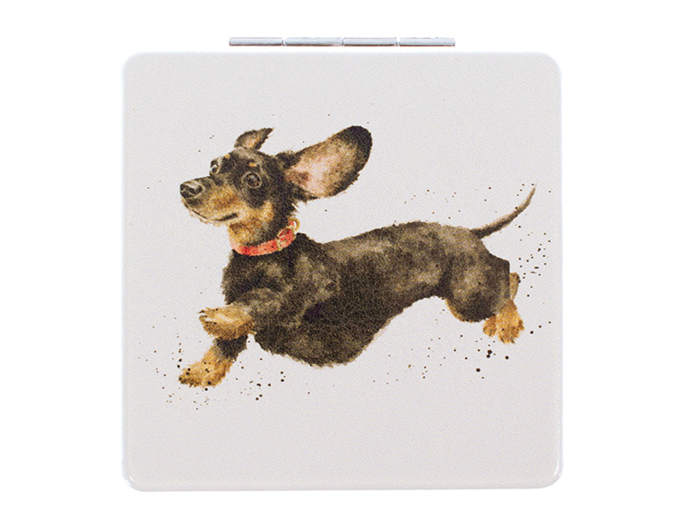 a cream square pocket mirror with a jumping dachshund on the front