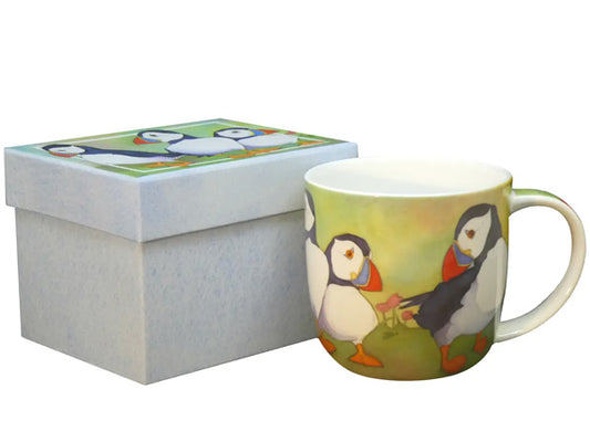 The "Puffins" Bone China Mug, created by Emma Ball, is elegantly presented in a stunning gift box, providing an ideal option for gifting or indulging in a delightful personal treat.  Dishwasher & Microwave Safe Capacity of 350ml Height 8.5 cm Diameter 9 cm