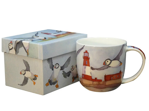 The "Puffins & a Lighthouse" Bone China Mug, designed by Emma Ball, arrives in an exquisite presentation box, ideal for gifting or as a delightful self-indulgence.  Dishwasher & Microwave Safe Capacity of 350ml Height 8.5 cm Diameter 9 cm