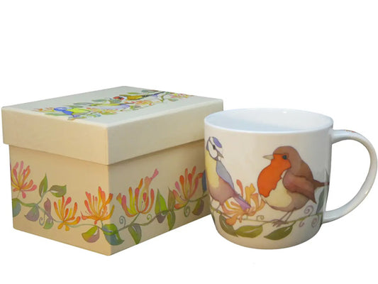 The "Garden Birds" Bone China Mug, an exquisite design by Emma Ball, is thoughtfully packaged in a charming presentation box, ideal for gifting or as a delightful personal indulgence.  Dishwasher & Microwave Safe Capacity of 350ml Height 8.5 cm Diameter 9 cm