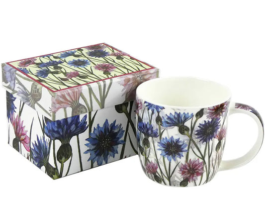Conceived by Caroline Cleave, this Fine Bone China mug adorned with Cornflowers is tastefully presented in a captivating gift box, making it the ideal gift for a special someone. Dishwasher & Microwave Safe Capacity of 350ml Height 8.5 cm Diameter 9 cm