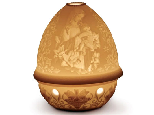 This amazing porcelain Lithophane Votive Light is delicately engraved with the young Virgin Mary holding a baby Jesus surrounded by flowers and is wonderfully depicted when lit. This piece is just one of the beautiful lithophanes we offer in our lithophane collection.