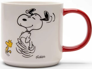 Get your groove on with this delightful Magpie x Peanuts mug, showing the iconic duo Snoopy & Woodstock engaged in a lively dance. Perfect for those who love a good brew and a dance or two, this mug makes a charming gift. The back of the mug features black writing 'To Dance is to Live'.