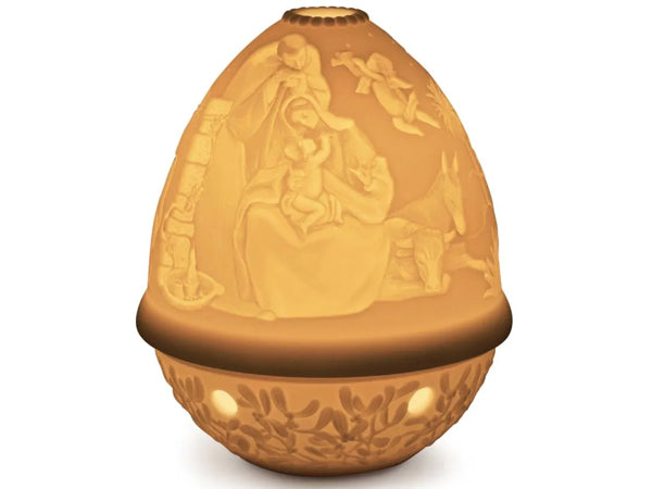 This amazing porcelain Lithophane Votive Light is delicately engraved showing the Virgin Mary holding the new born baby Jesus in the stable, which is finely depicted when lit. This piece is just one of the beautiful lithophanes we offer in our lithophane collection. 