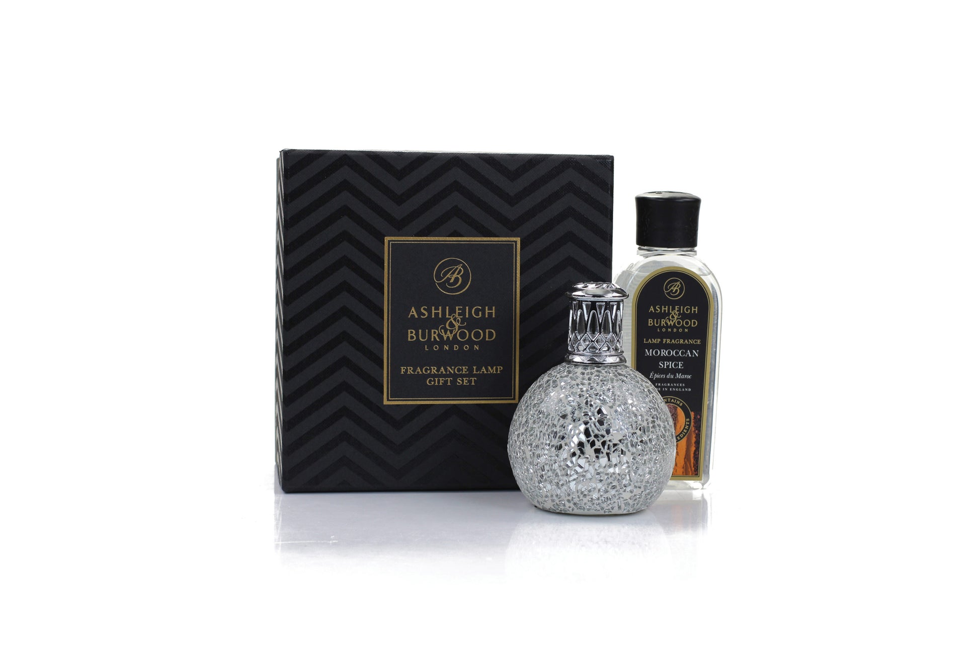 A boxed set of a silver fragrance lamp with a Moroccan spice scented liquid