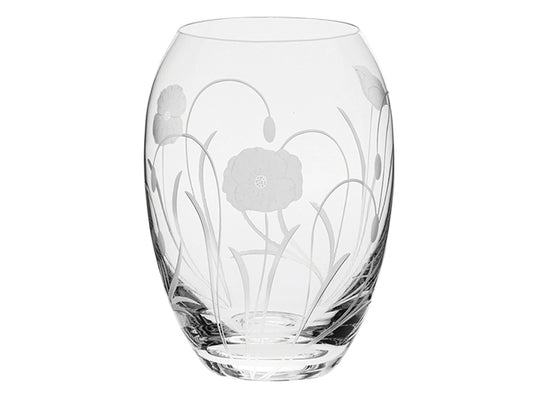 A barrel-shaped crystal vase with a poppy design engraved on the outside