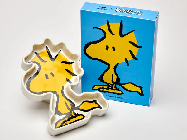 Woodstock character–shaped ceramic dish in yellow with black outline, displayed beside its blue Peanuts gift box.