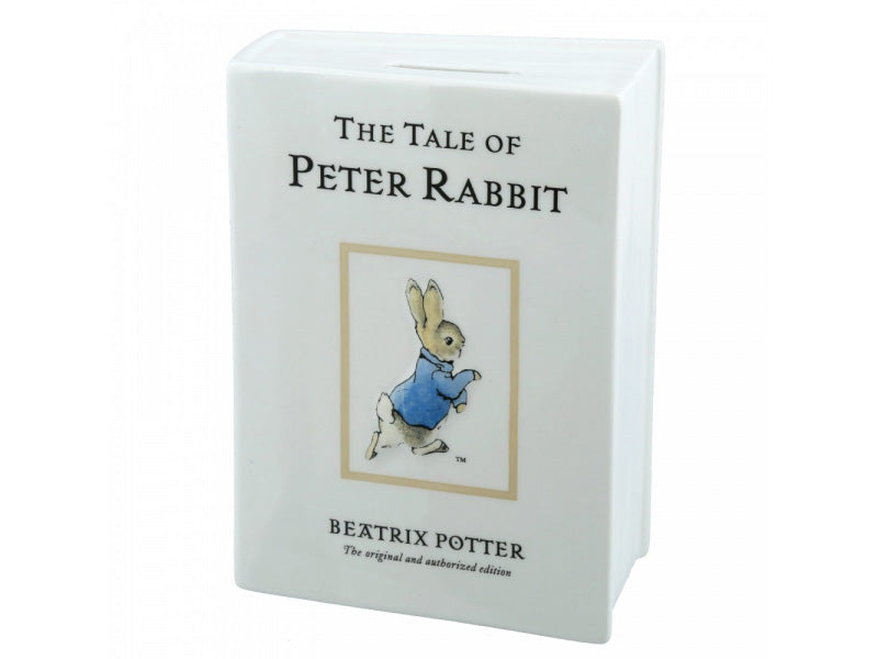 This meticulously crafted porcelain book-shaped money bank is showcasing an enchanting illustration of the beloved Peter Rabbit.