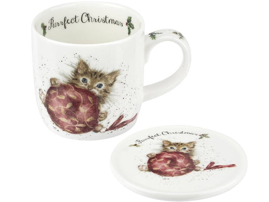 Mug and coaster set with a design of a kitten holding a bauble, on a white background.