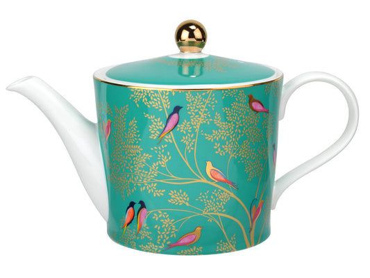 A green and white teapot with gold leaves and brightly coloured birds decorating the outside