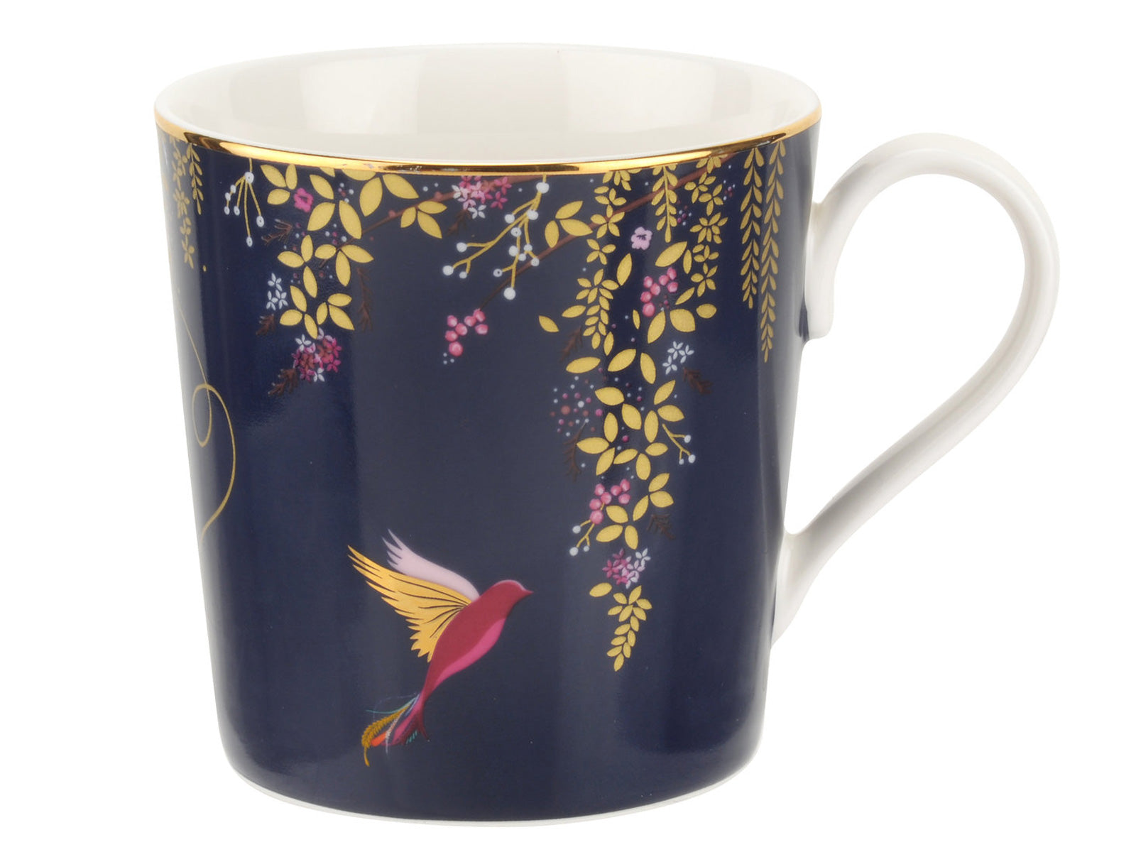 A navy blue porcelain mug with a gold edge and leaves trailing down the side, with a hummingbird ready to feed from the small pink flowers on the trailing foliage.