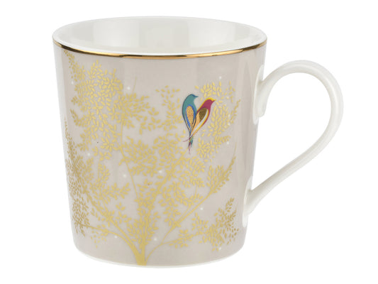 A light grey mug with intricate gold foliage design featuring two brightly coloured birds.