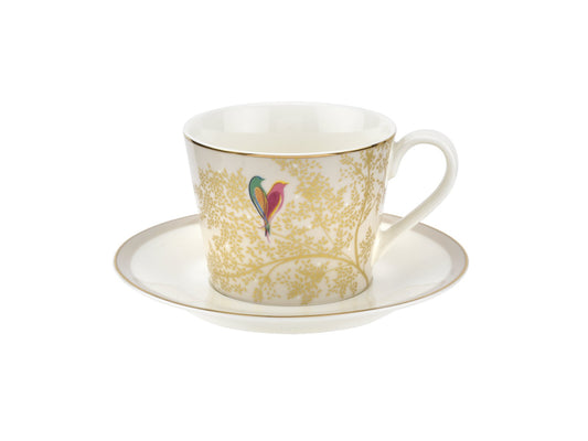 A white porcelain teacup and saucer, decorated with a subtle light grey base, gold detailing and a pair of love birds
