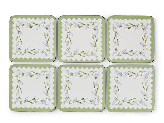 Set of six square coasters with floral design on a white background