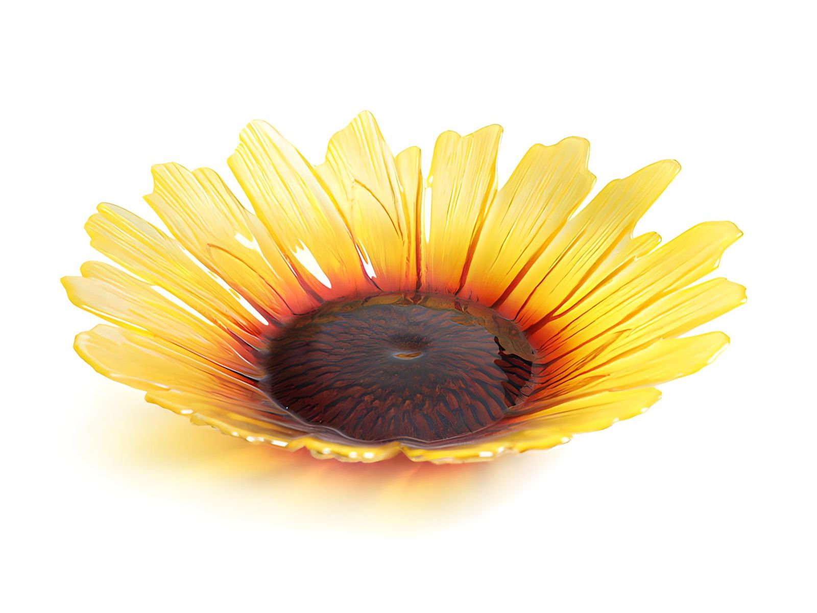 A large crystal bowl in the shape of a sunflower, the yellow leaves are textured and lead to a brown and orange centre.
