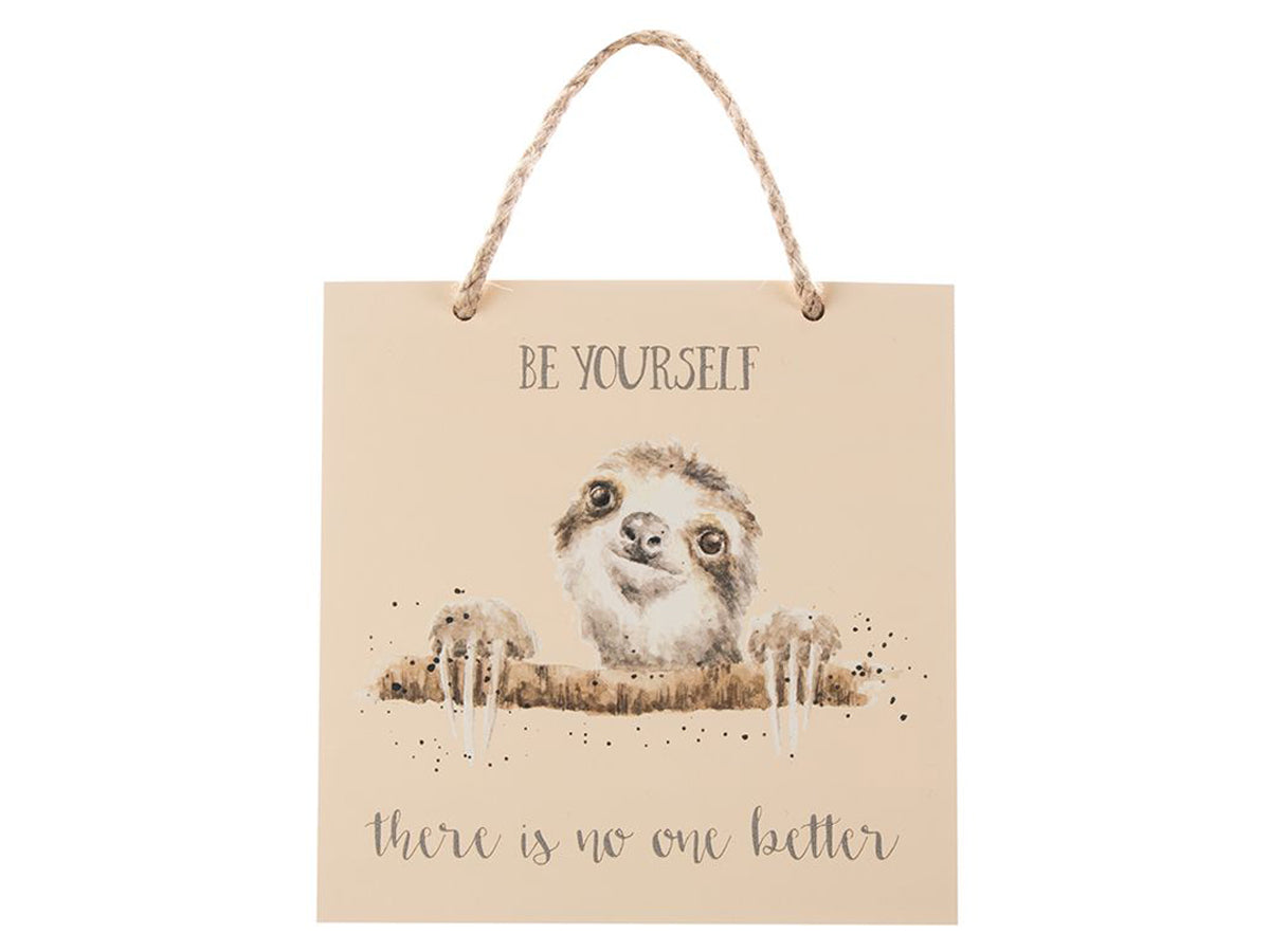 A square plaque with a twine cord hanger witha sloth illustration on the front