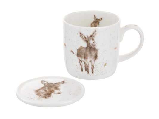 A white china mug and coaster with donkey designs on them in a watercolour style