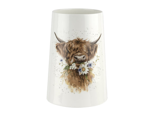 A white porcelain vase with a highland cow eating flowers depicted on the front