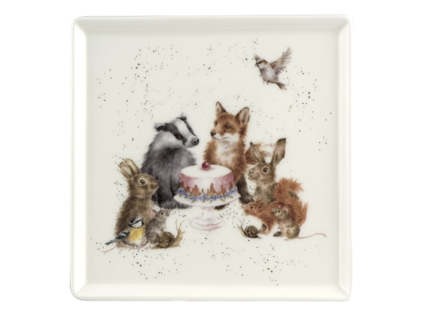 A white ceramic plate featuring a watercolour illustration of woodland animals gathered around a cake stand. The animals include a badger, fox, blue tit, sparrow, squirrels, snails, and rats. The cake stand holds a pink frosted cake. The plate's background showcases Wrendale's distinctive eggshell speckles.
