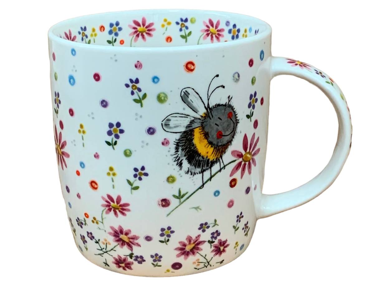 A white ceramic mug decorated with a colorful floral pattern and a central illustration of a bumblebee.