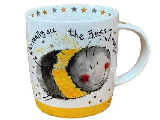 A white ceramic mug featuring a whimsical illustration of a bee with the text 'You really are the Bees Knees' and small stars around the rim and base.