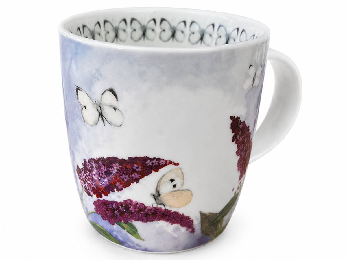 A white ceramic mug decorated with a watercolor-style design featuring purple flowers, butterflies, and a soft blue-gray wash on the side, shown against a plain white background.