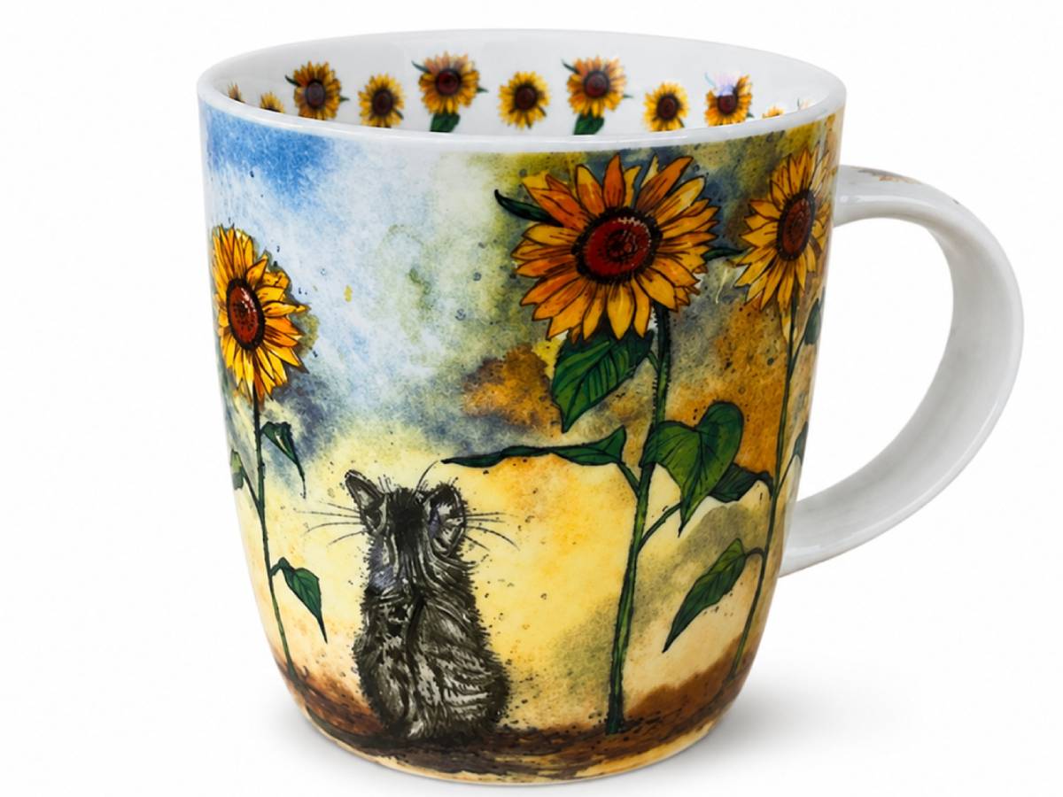 A white ceramic mug decorated with a watercolor-style design featuring yellow sunflowers, green leaves, a blue sky, and a small gray cat at the bottom.