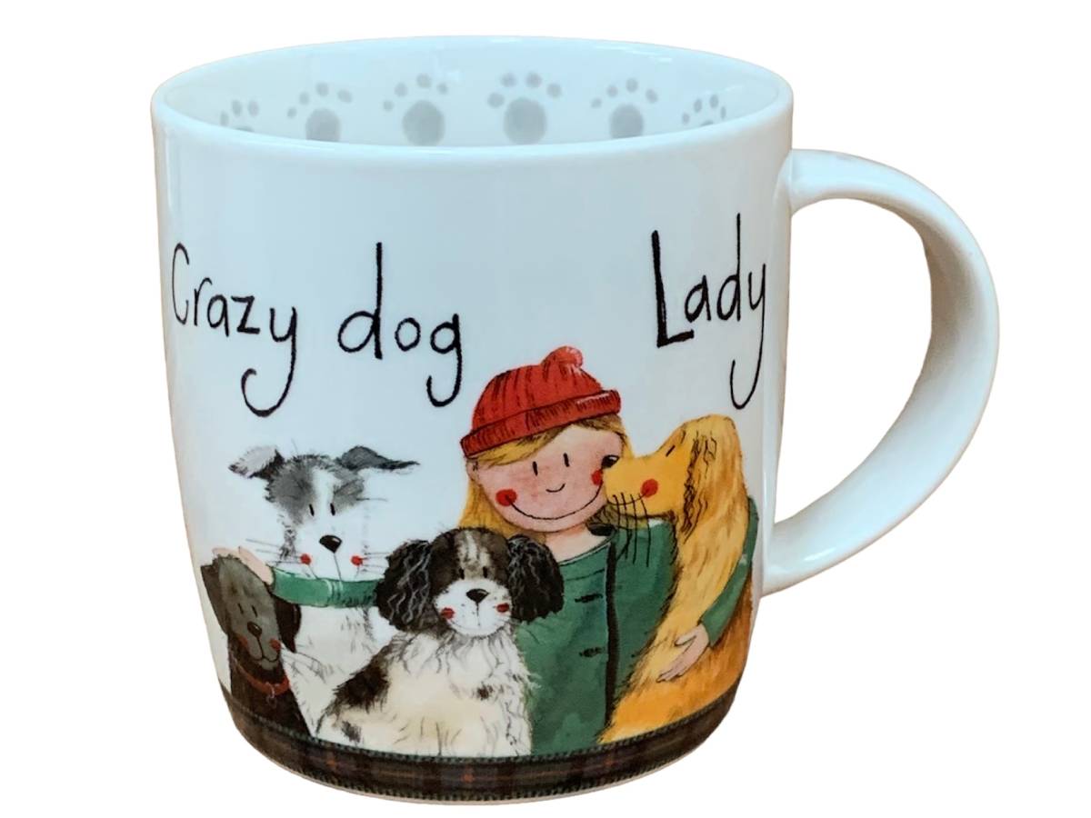 A white ceramic mug featuring a colorful illustration of a woman hugging three dogs, with the text 'Crazy dog Lady' written in black script.