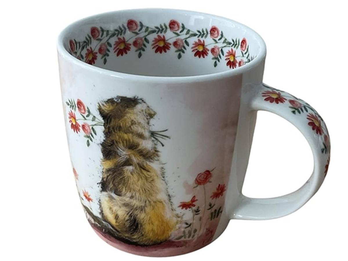 A white ceramic mug featuring a detailed illustration of a brown and yellow guinea pig, surrounded by red and pink flowers with green leaves. The inside of the mug and the handle are decorated with a matching floral pattern.