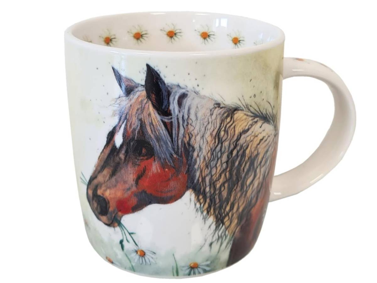 A white ceramic mug featuring a detailed illustration of a brown and beige pony in profile, with small daisy-like flowers printed around the inside rim and near the bottom.