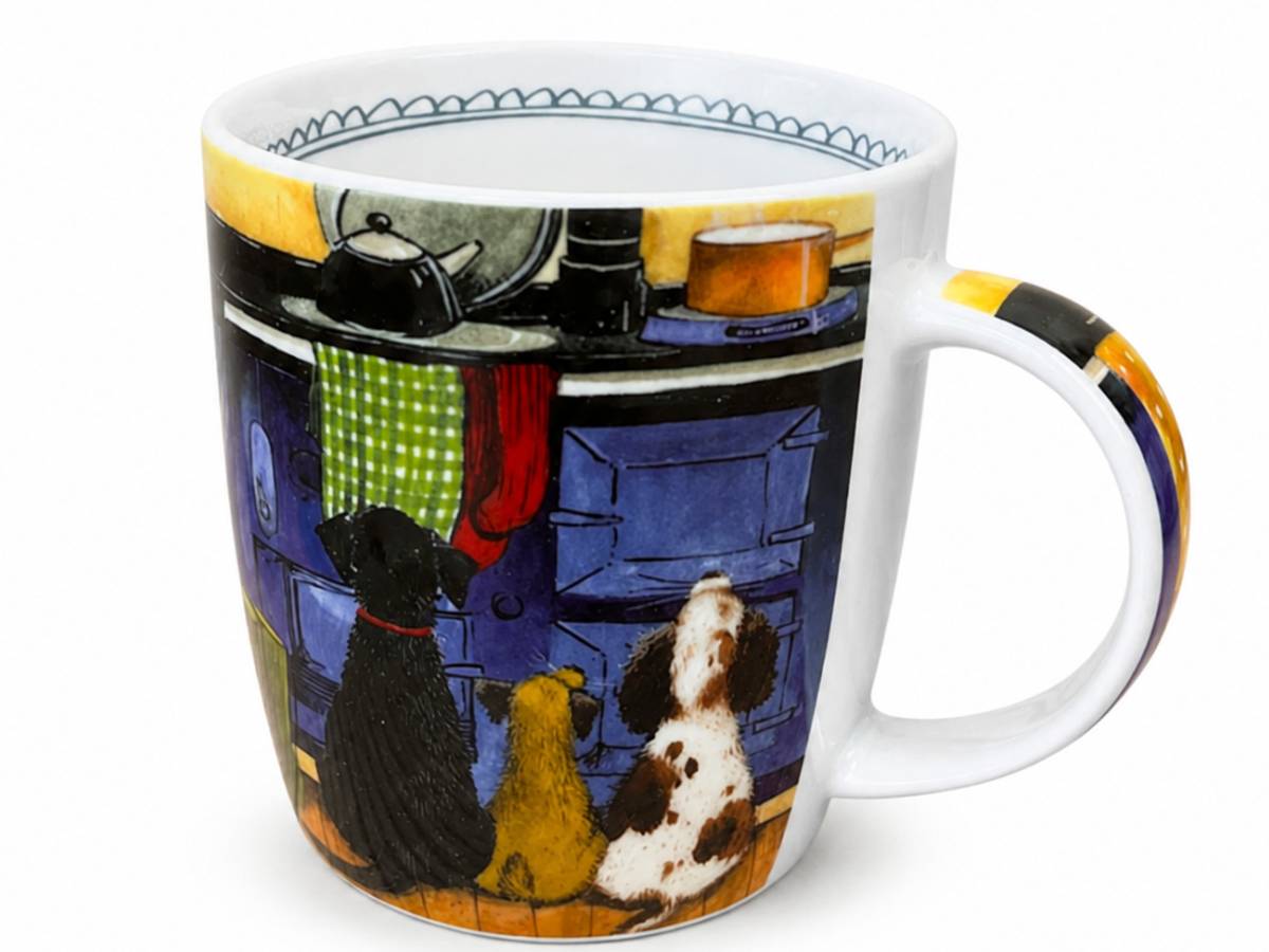 A white ceramic mug featuring a colorful printed illustration of two dogs looking at a blue stove, with a patterned handle and inner rim.